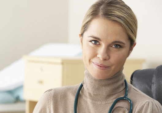 Young female clinician wearing stethoscope